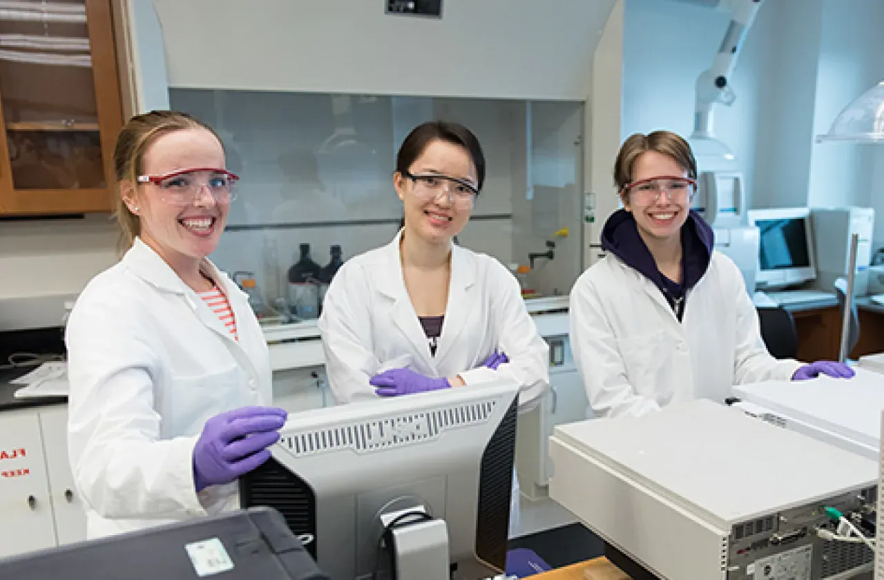 Three students in a lab in Ford Hall